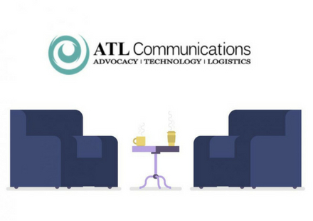 coaches and coffee table w/ATL Communications logo